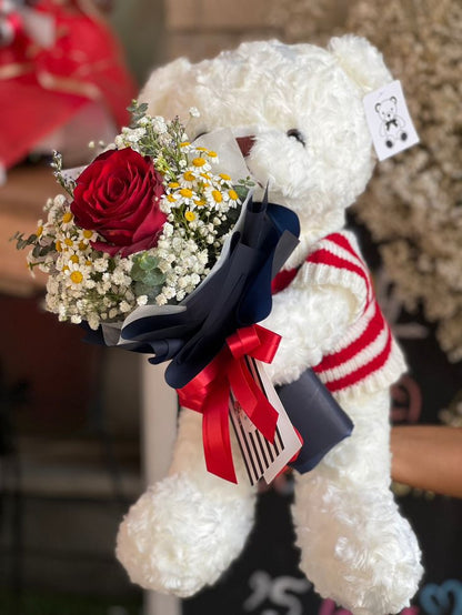 Oso de peluche con ramo de flores y rosa roja